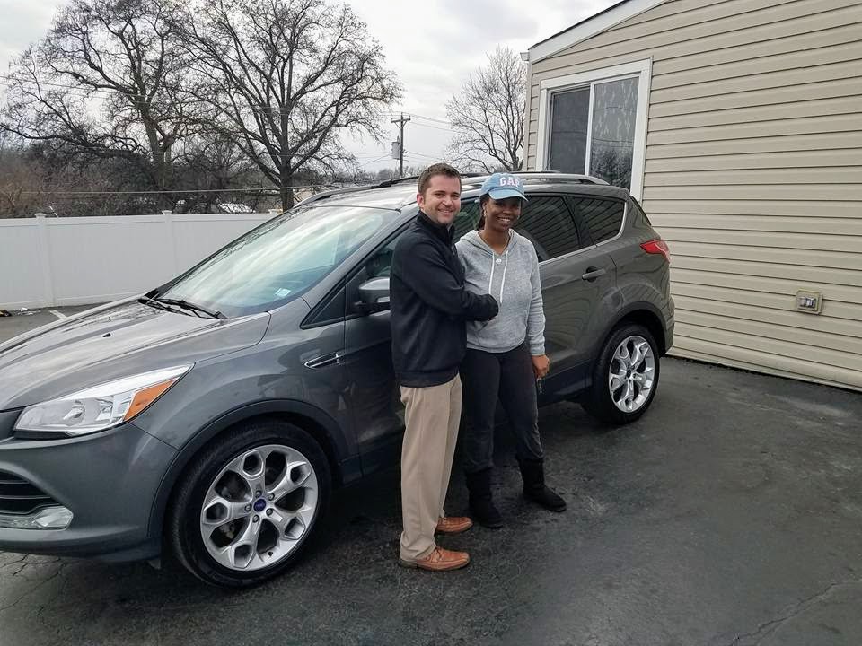 Green Light Auto Credit Customer with new SUV and salesperson