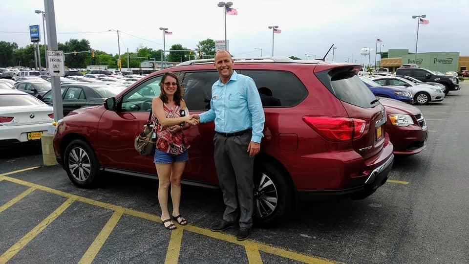 Green Light Auto Credit Customer and Sales Person Shaking Hands with New Nissan Murano