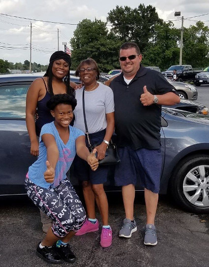 family with new car