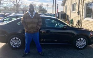 Happy man who recently bought car with the help of Green Light Auto Credit