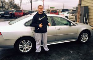 Happy Car Buyer with Green Light Auto Credit