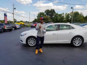 Green Light Auto Customer Thumbs up with new car