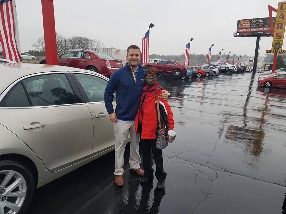 Green Light Auto Credit Grinning Happy Customer And Sales Person With New Car