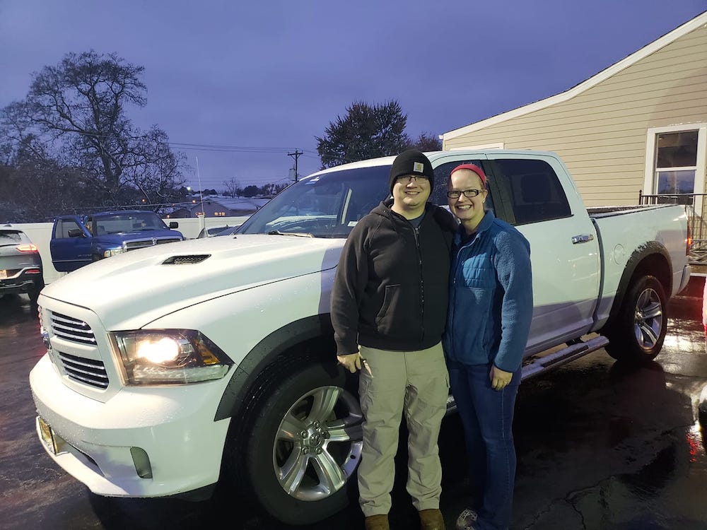 Happy customer with pickup truck